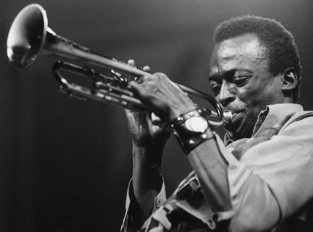 American jazz musician and composer Miles Davis (1926 - 1991) playing the trumpet.   (Photo by Express Newspapers/Getty Images)